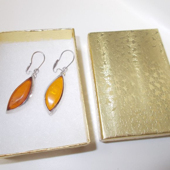 unbranded Jewelry - EUC, Amber pierced earrings, approximately 2.5"x.1/2"